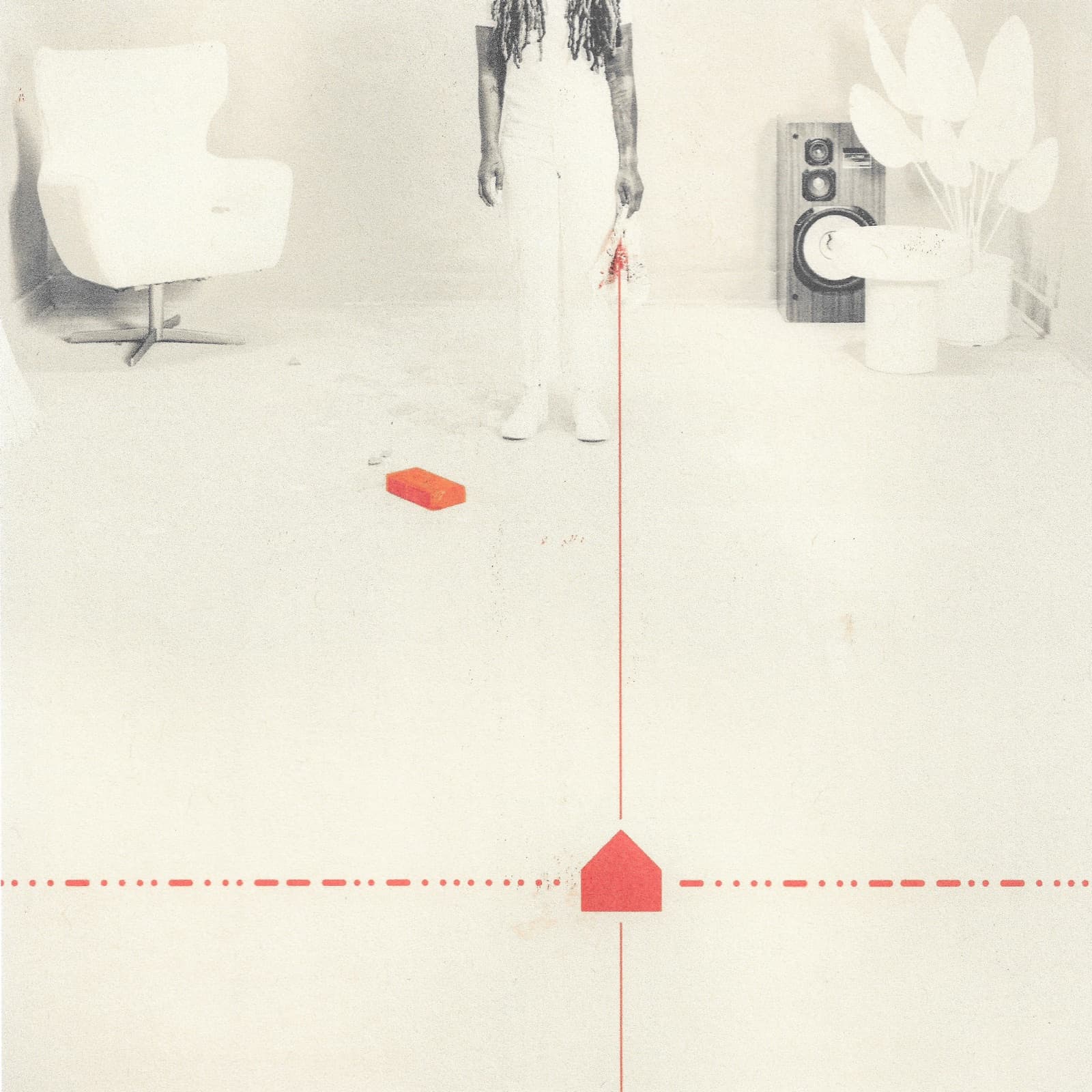 A white living room with a red house mark on the floor